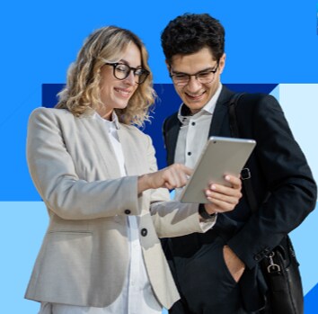 man and woman looking at tablet