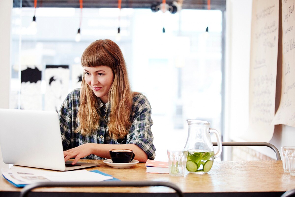Lady in sitting at laptop 