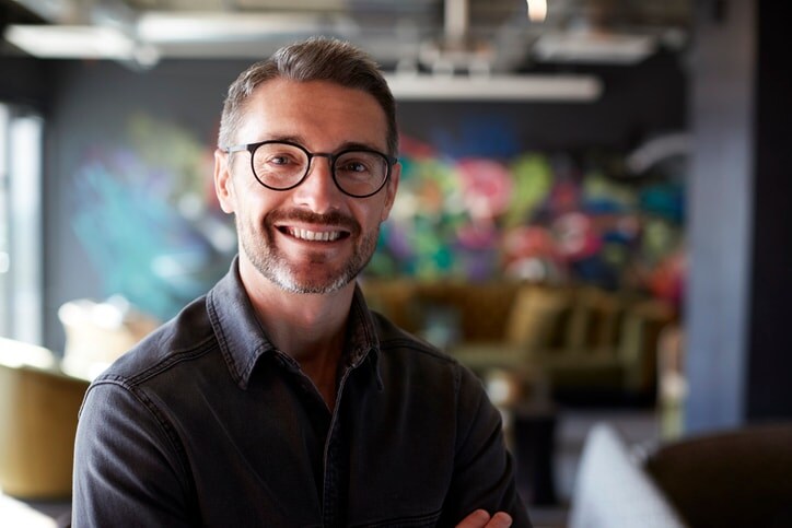 Man smiling wearing glasses