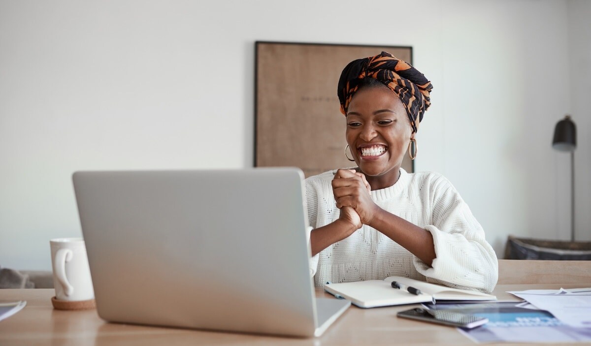 woman smiling at computer