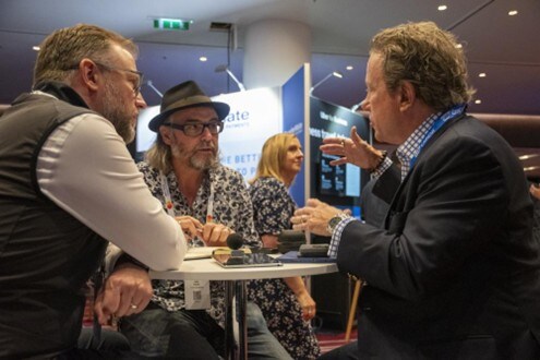 Chris Juneau from SAP Concur and James Lee from Mastercard speak to Jake Smith