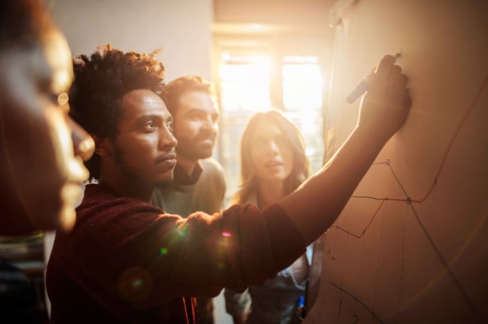 people looking at whiteboard