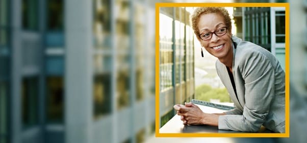 Smiling woman at window sill