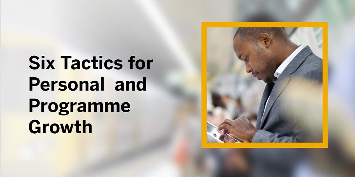 man on public transport with mobile phone