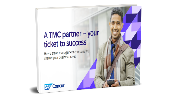 Man with phone in hand looking up smiling 